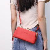 Compacte crossbody telefoontas met verstelbare schouderband