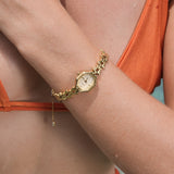 Goudkleurig dameshorloge met verstelbare messing armband