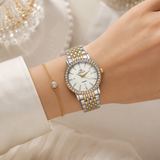 Dameshorloge met glinsterende bezel en schakelband