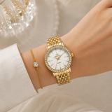 Dameshorloge met glinsterende bezel en schakelband