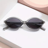 Ovale Retro Zonnebril voor Minimalistische en Trendy Look