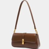 Compacte crossbody tas met klepsluiting en gouden detail