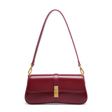 Compacte crossbody tas met klepsluiting en gouden detail