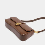 Compacte crossbody tas met klepsluiting en gouden detail