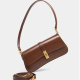 Compacte crossbody tas met klepsluiting en gouden detail