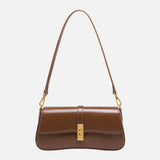 Compacte crossbody tas met klepsluiting en gouden detail