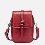 Compacte crossbody tas met verstelbare schouderband en gespsluiting