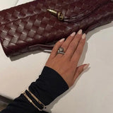 Gevlochten Clutch Tas met Luxe Sluiting.