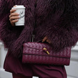 Gevlochten Clutch Tas met Luxe Sluiting.