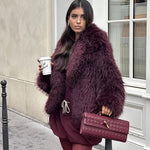 Gevlochten Clutch Tas met Luxe Sluiting.