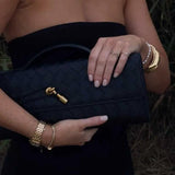 Gevlochten Clutch Tas met Luxe Sluiting.