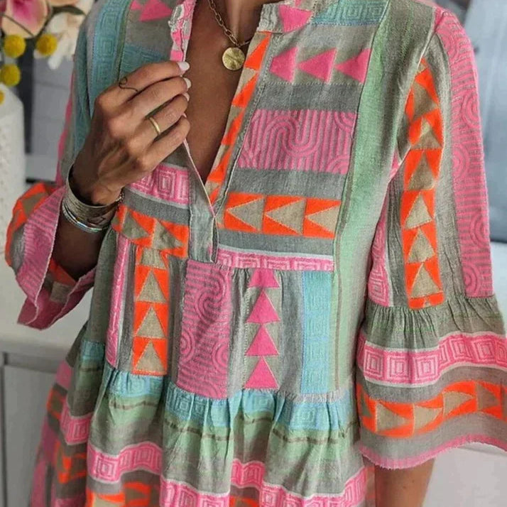 Meerkleurige Tuniekjurk met Geometrische Print en Volantmouwen.