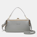 Compacte crossbody telefoontas met verstelbare schouderband