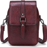 Compacte crossbody tas met verstelbare schouderband en gespsluiting