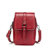 Compacte crossbody tas met verstelbare schouderband en gespsluiting